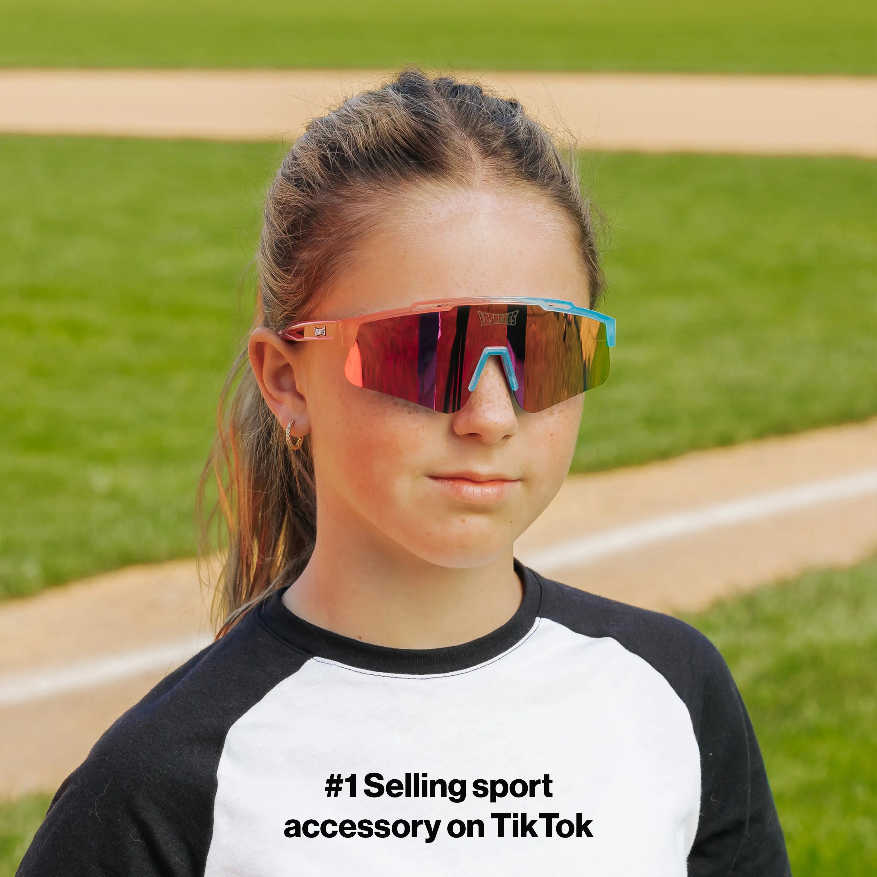 LosReyes PrimeYouth Candy Collection "Cotton Candy" youth sunglasses with UV400 protection on baseball field