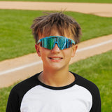 LosReyes PrimeYouth Candy Collection "Cream Blue" youth sunglasses with UV400 protection on baseball field
