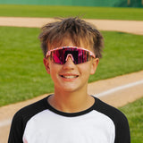 LosReyes PrimeYouth Candy Collection "Cream Pink" youth sunglasses with UV400 protection on baseball field