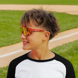 LosReyes PrimeYouth Candy Collection "Cream Red" youth sunglasses with UV400 protection on baseball field