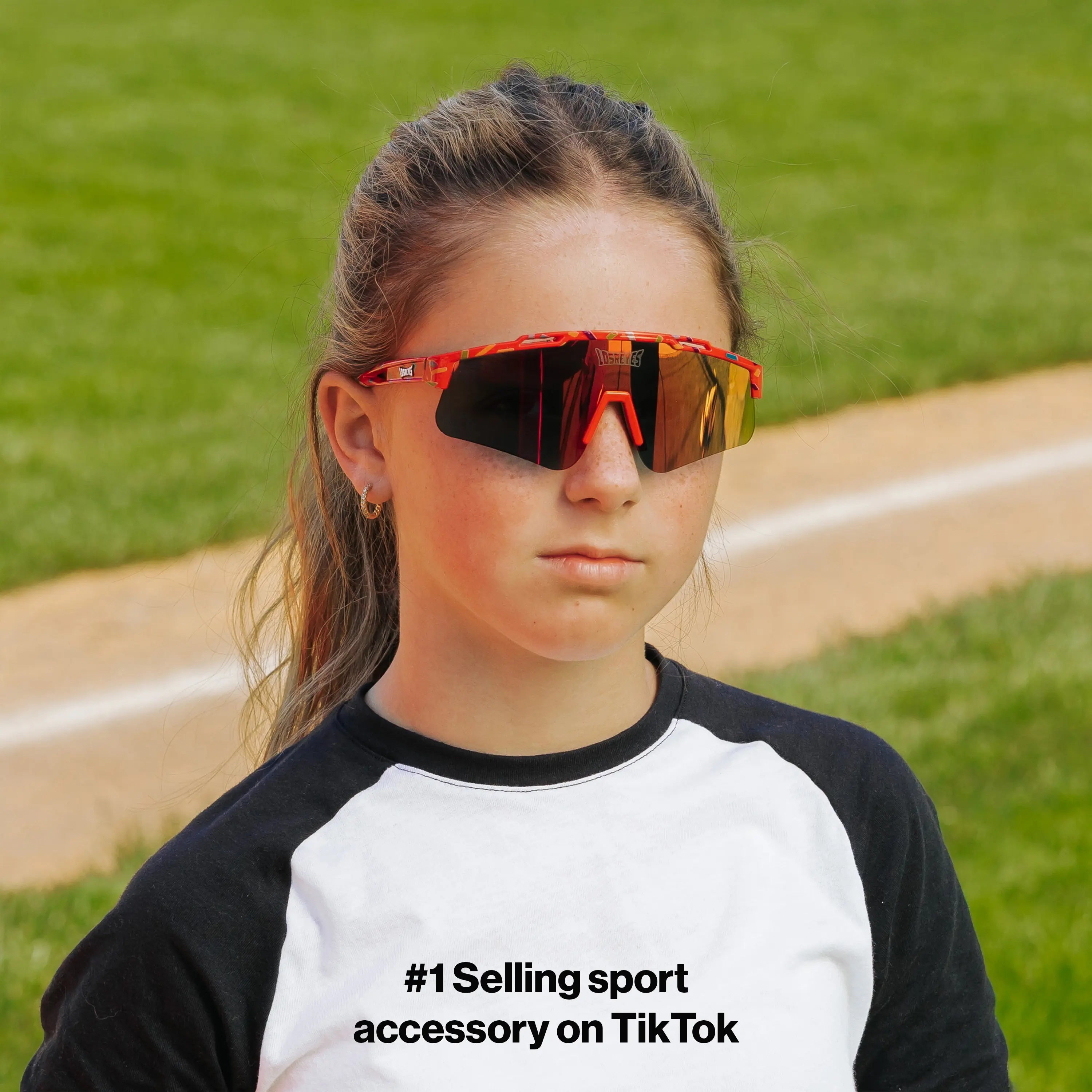 LosReyes PrimeYouth Candy Collection "Cream Red" youth sunglasses with UV400 protection on baseball field