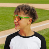 LosReyes PrimeYouth Candy Collection "Sour Apple" youth sunglasses with UV400 protection on baseball field