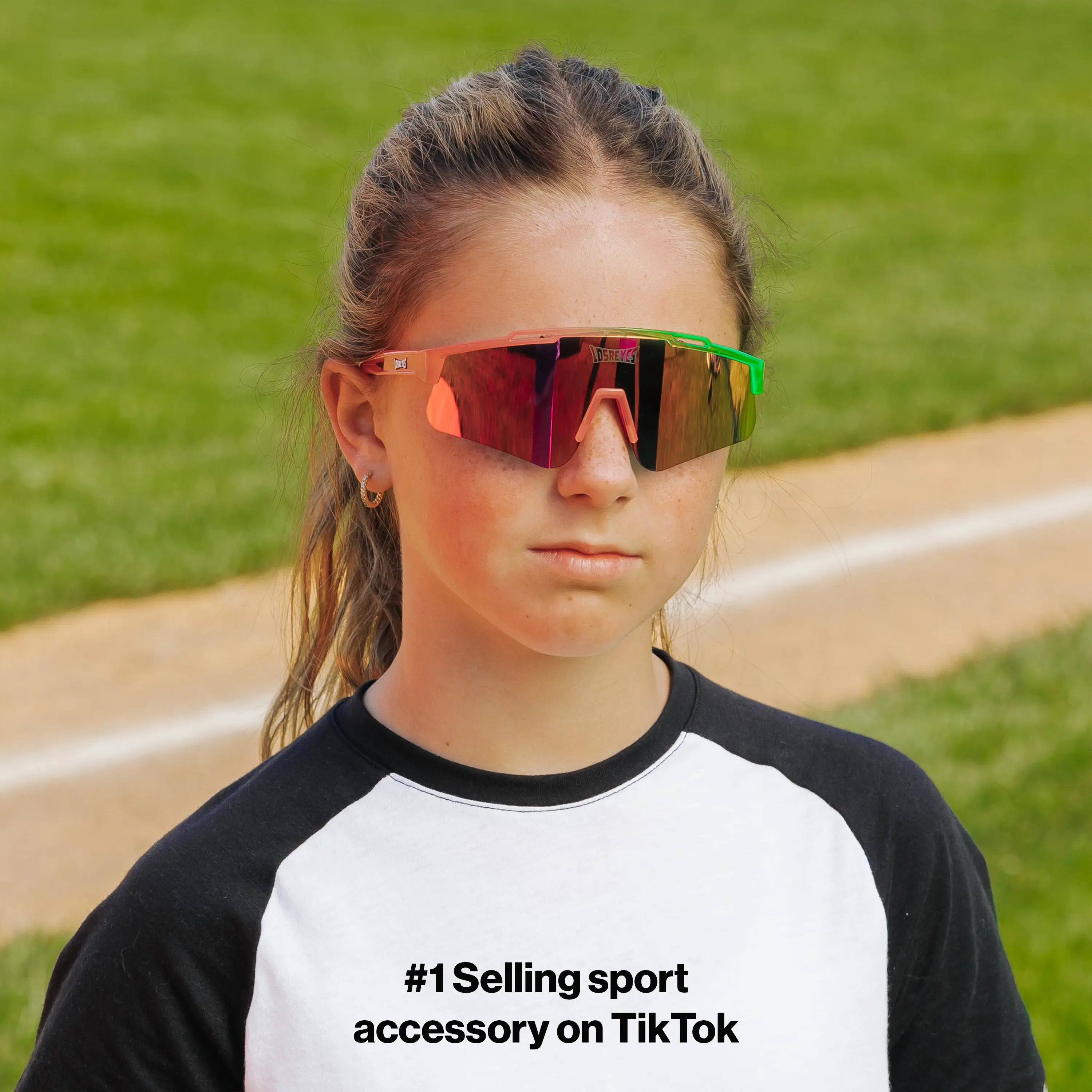 LosReyes PrimeYouth Candy Collection "Sour Apple" youth sunglasses with UV400 protection on baseball field