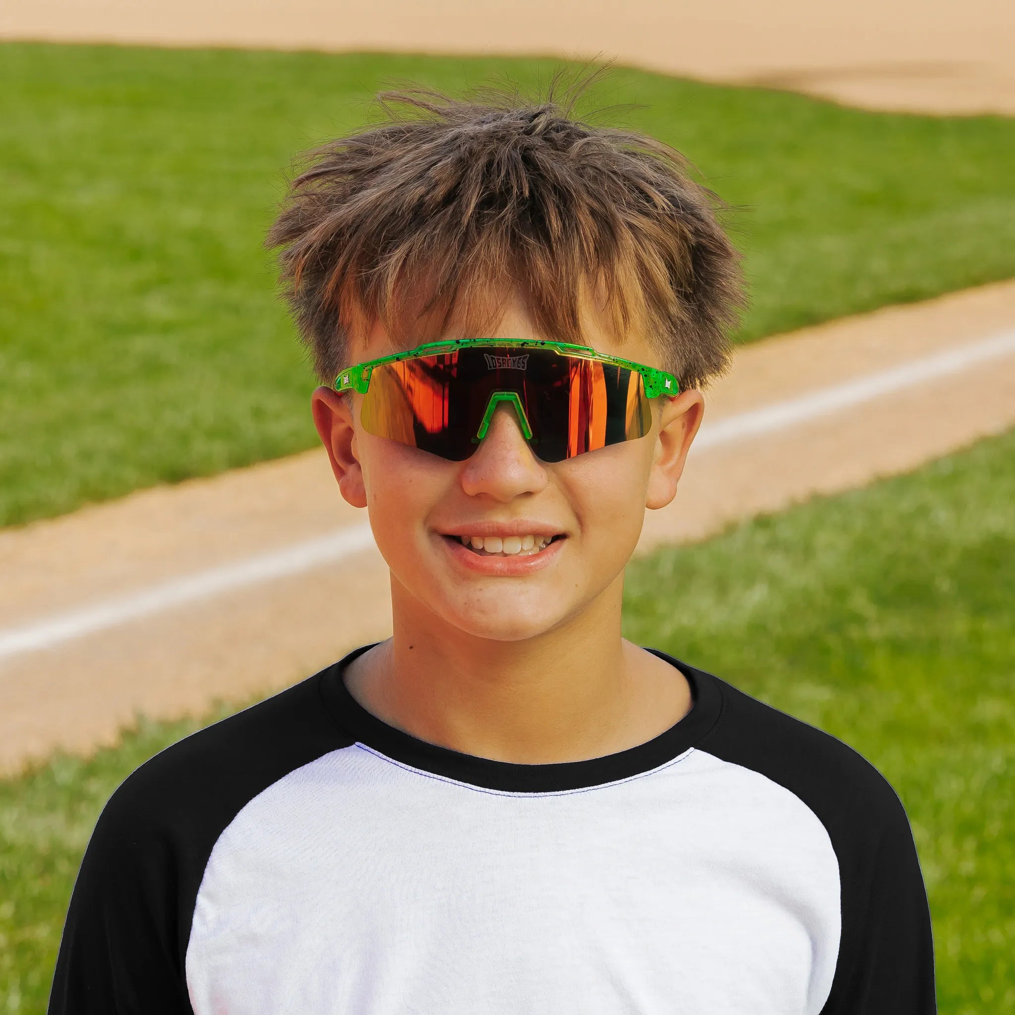 LosReyes PrimeYouth Candy Collection "Watermelon" youth sunglasses with UV400 protection on baseball field
