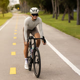 Cyclist riding on open road wearing LosReyes SHOWTIME cycling sunglasses, delivering stable fit and clear vision at speed
