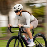 LosReyes SHOWTIME Hurricane performance sunglasses on cyclist riding at speed, lightweight frame with full coverage lenses for road cycling