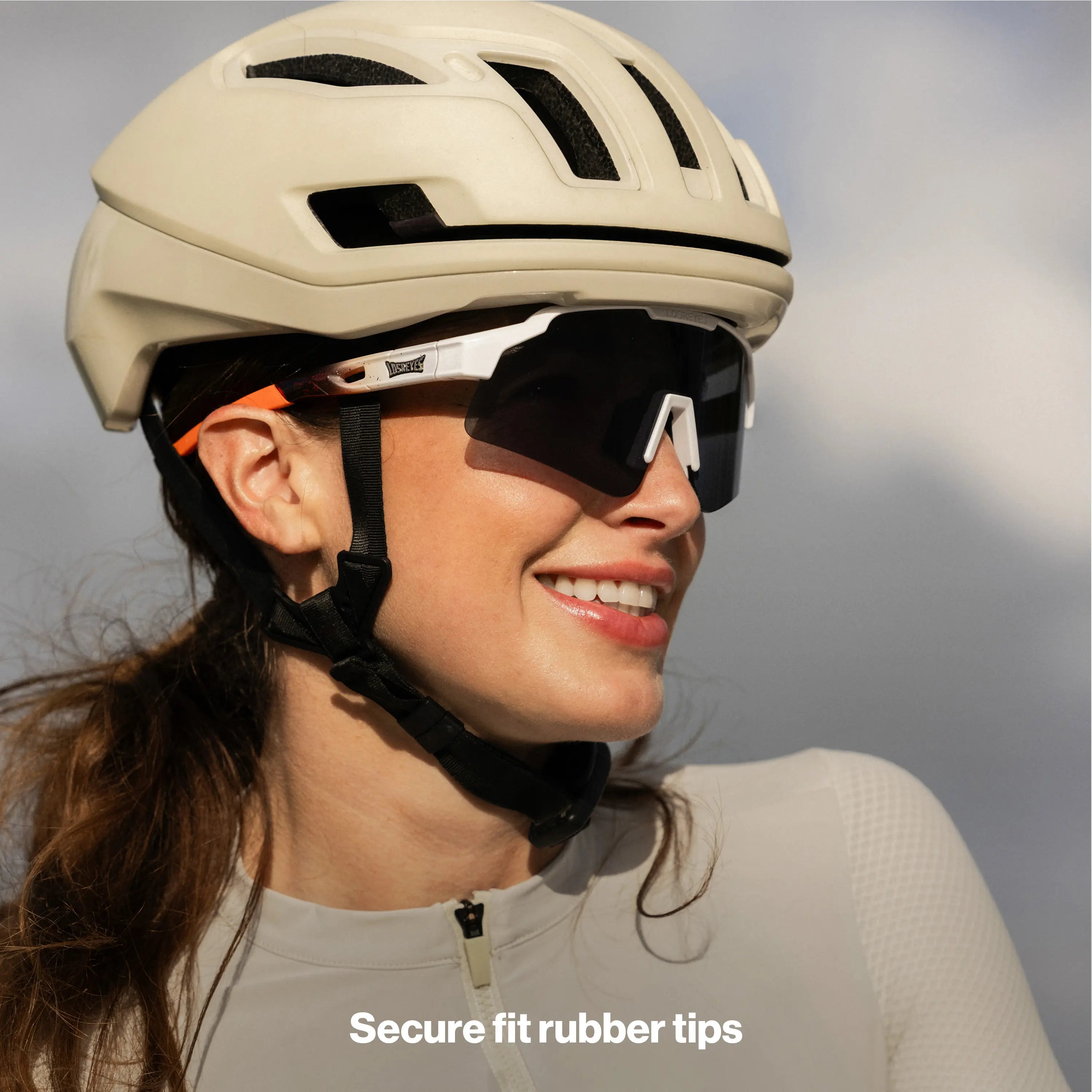 LosReyes SHOWTIME Hurricane Reversed sunglasses with black shield lens and white frame, worn by cyclist standing outdoors under helmet