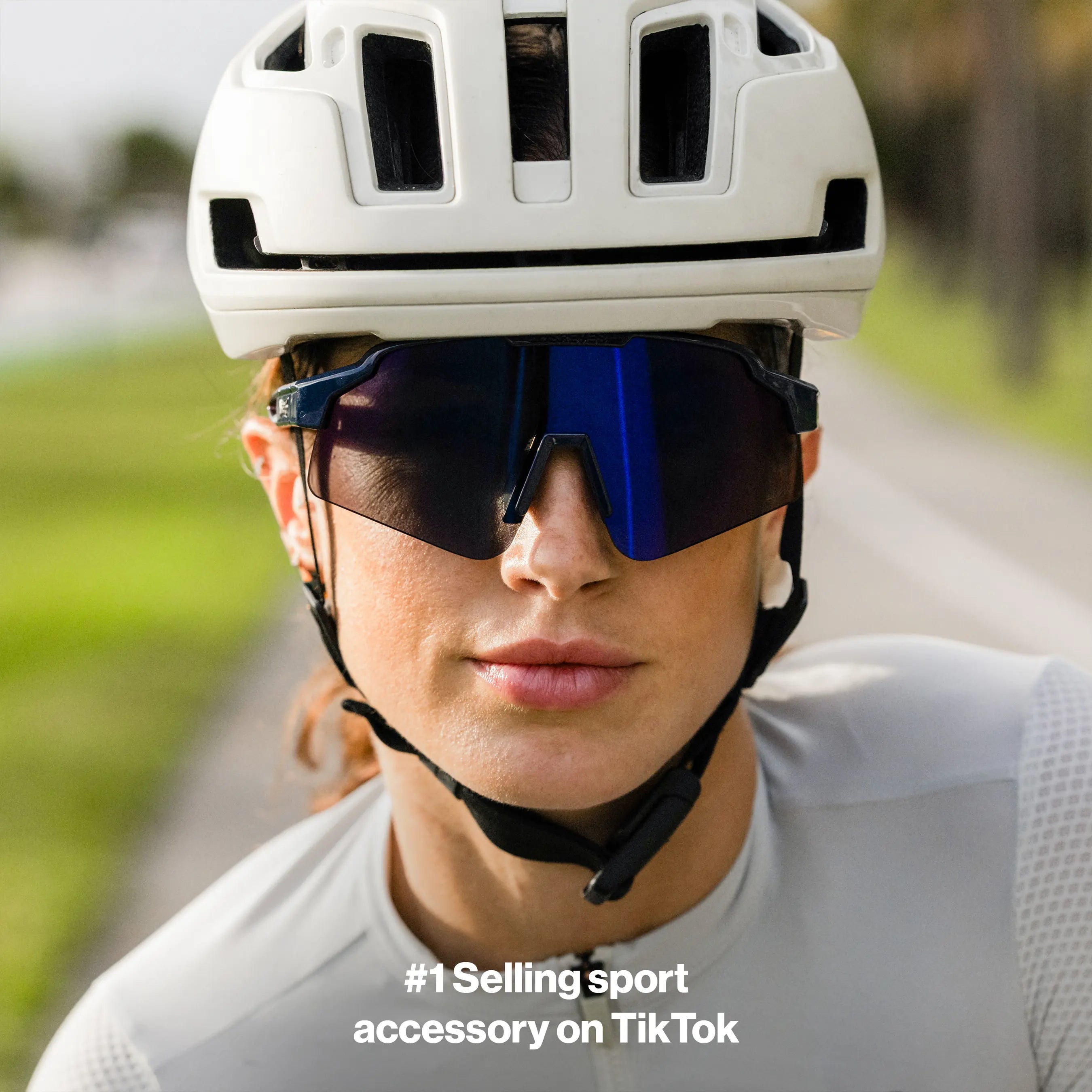 Close-up of LosReyes SHOWTIME Hurricane sunglasses featuring dark wraparound lenses and streamlined frame for cycling and endurance sports