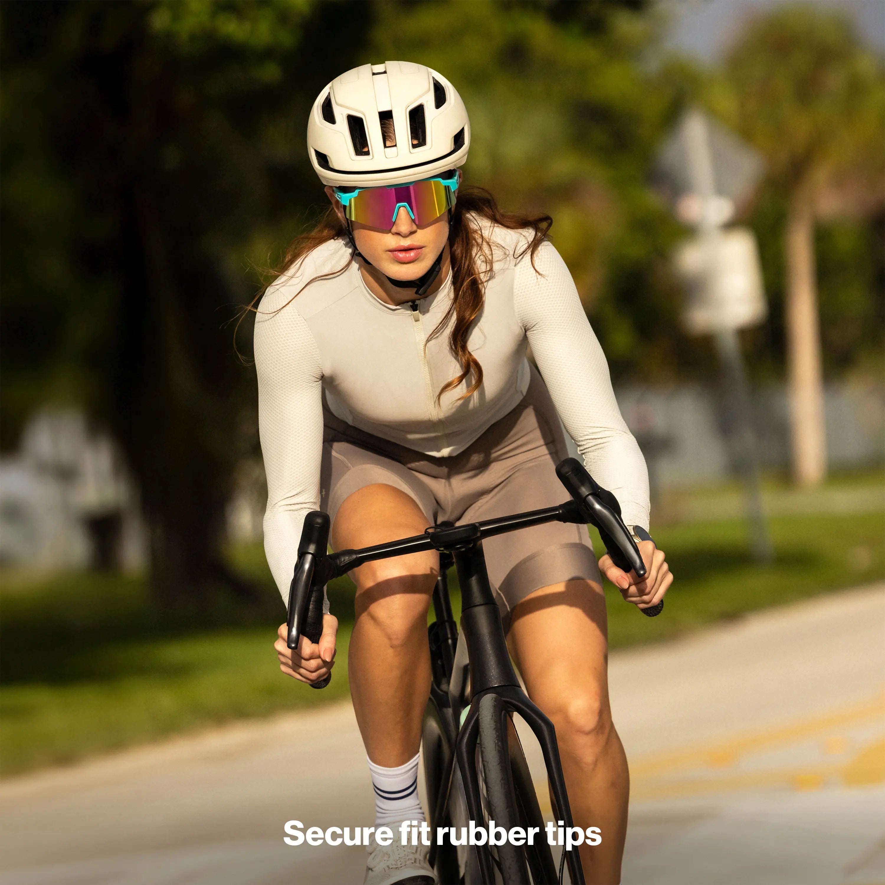 LosReyes SHOWTIME Vice Reversed performance sunglasses worn by cyclist riding head-on, full-coverage mirrored lens for road cycling