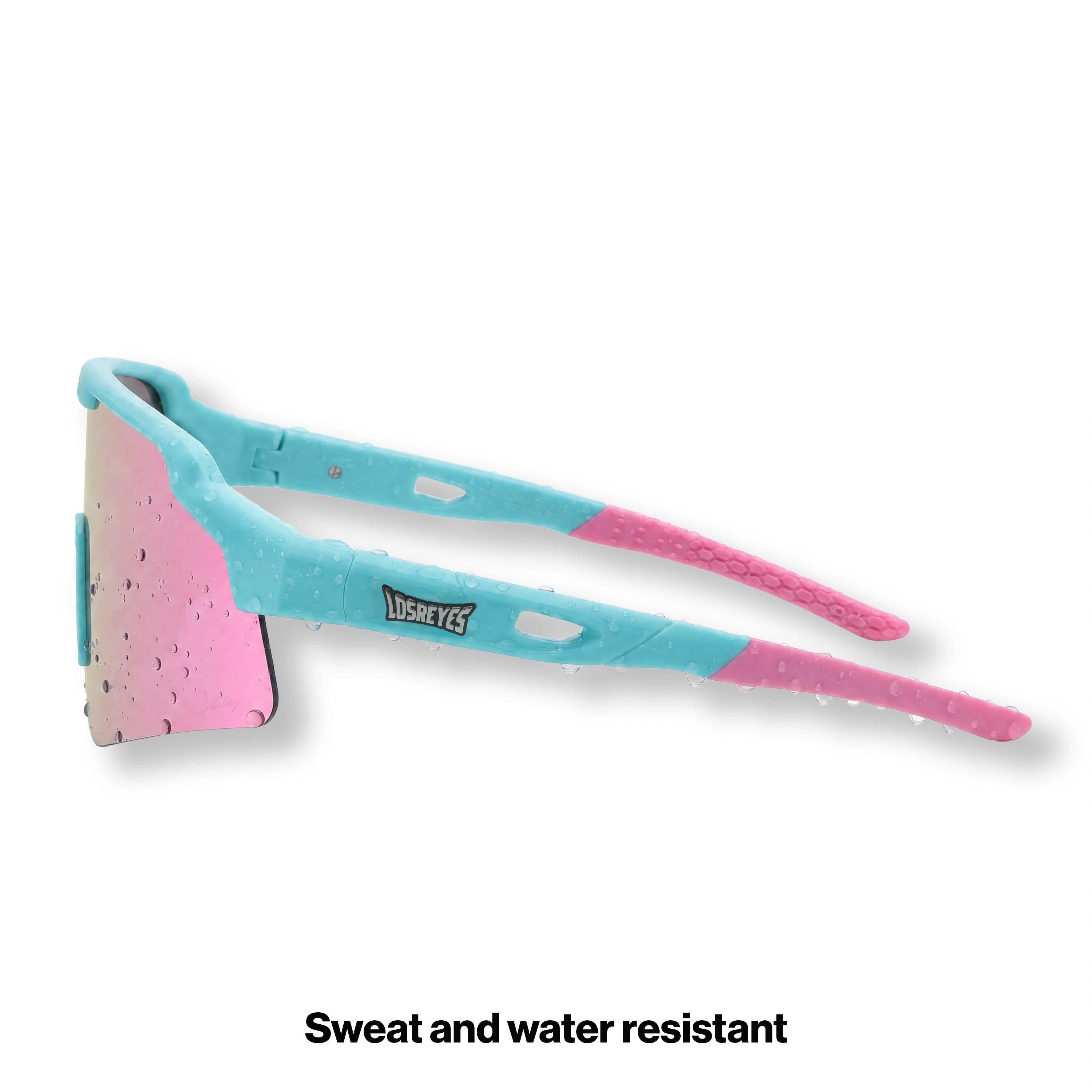 Side view of LosReyes Showtime Vice Reversed sunglasses in signature pink and teal colorway with mirrored shield lens and flexible arms for sport-ready comfort and style.
