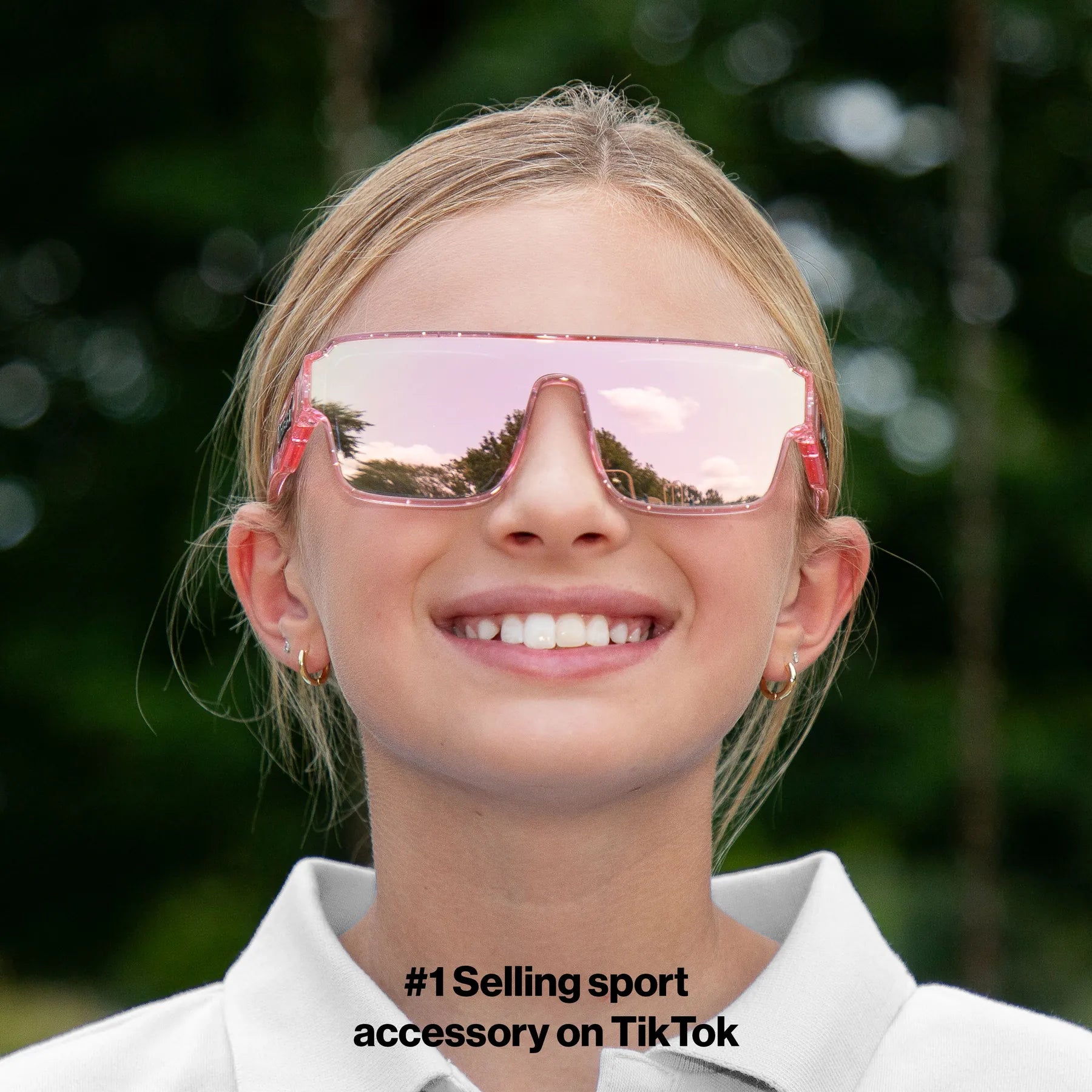 Child wearing LosReyes youth Pink Unicorn sport sunglasses in pink glitter with pink mirror lens, front view outdoors