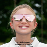 Child wearing LosReyes youth Pink Unicorn sport sunglasses in pink glitter with pink mirror lens, front view outdoors