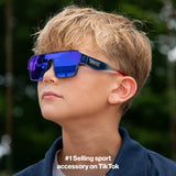 Side profile of child wearing LosReyes youth Superhero sport sunglasses in blue with blue mirror lens