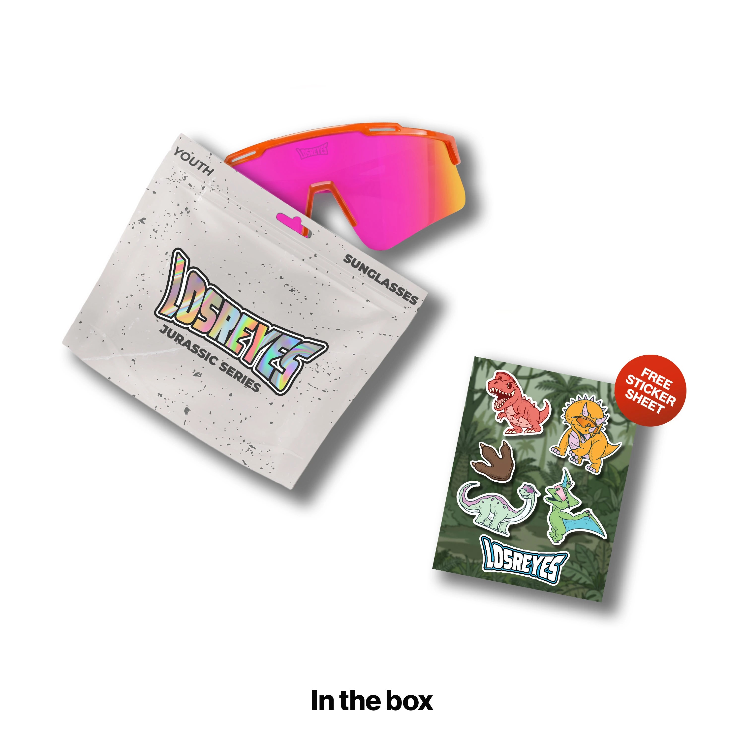LosReyes Youth Jurassic Series Triceratops sunglasses with an orange frame fading to pink rubber tips and a pink mirror lens, shown with a resealable YOUTH pouch and a free dinosaur sticker sheet