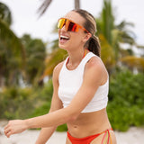 Female beach volleyball player wearing LosReyes Mars sunglasses from the Galaxy Collection, built for high-brightness conditions with scratch-resistant and water-resistant lenses.