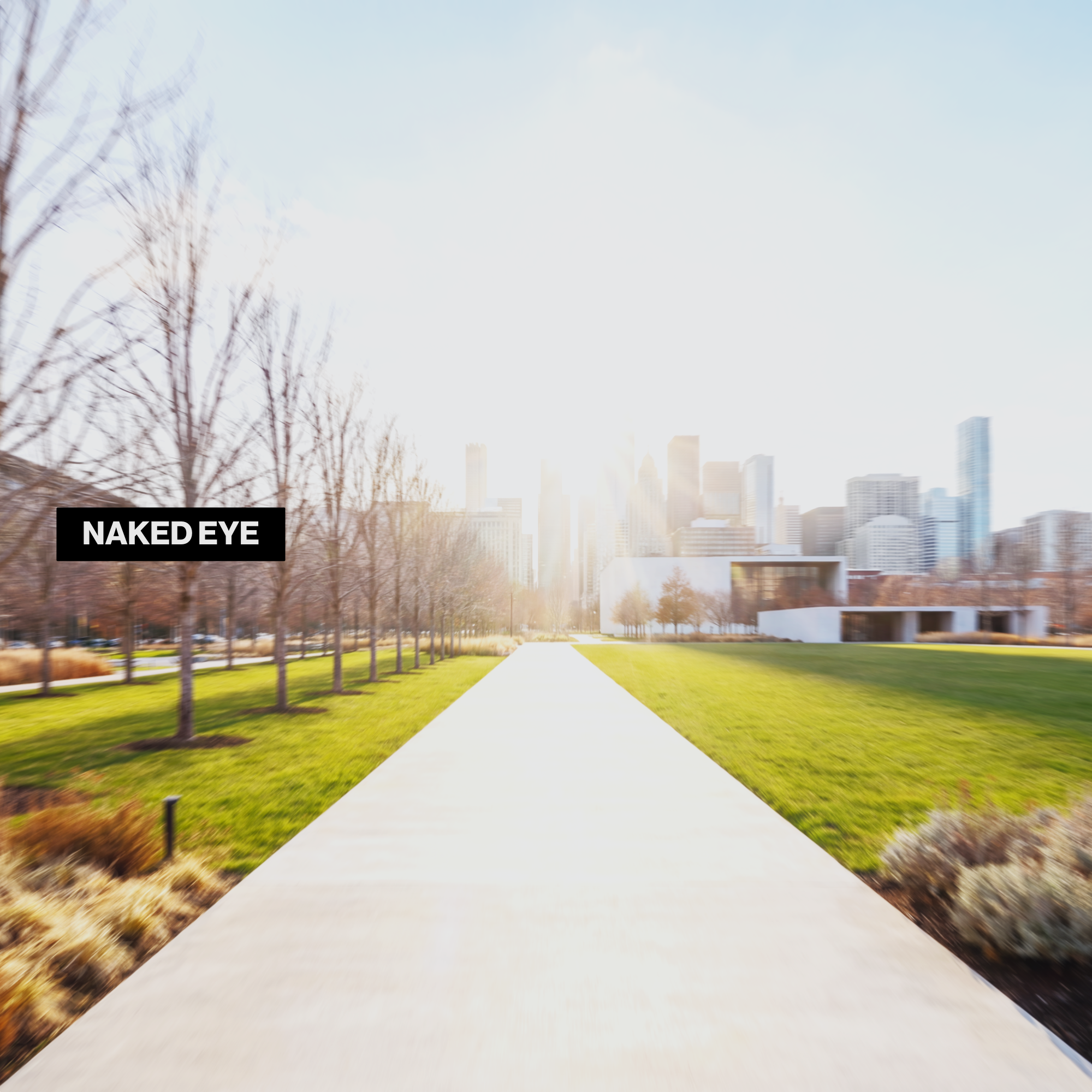 Outdoor city park path viewed without sunglasses, showing bright glare and haze