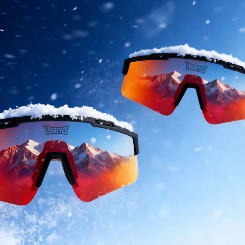 Red polarized sunglasses from LosReyes with mountain reflection against a snowy blue sky, best gift under 40$