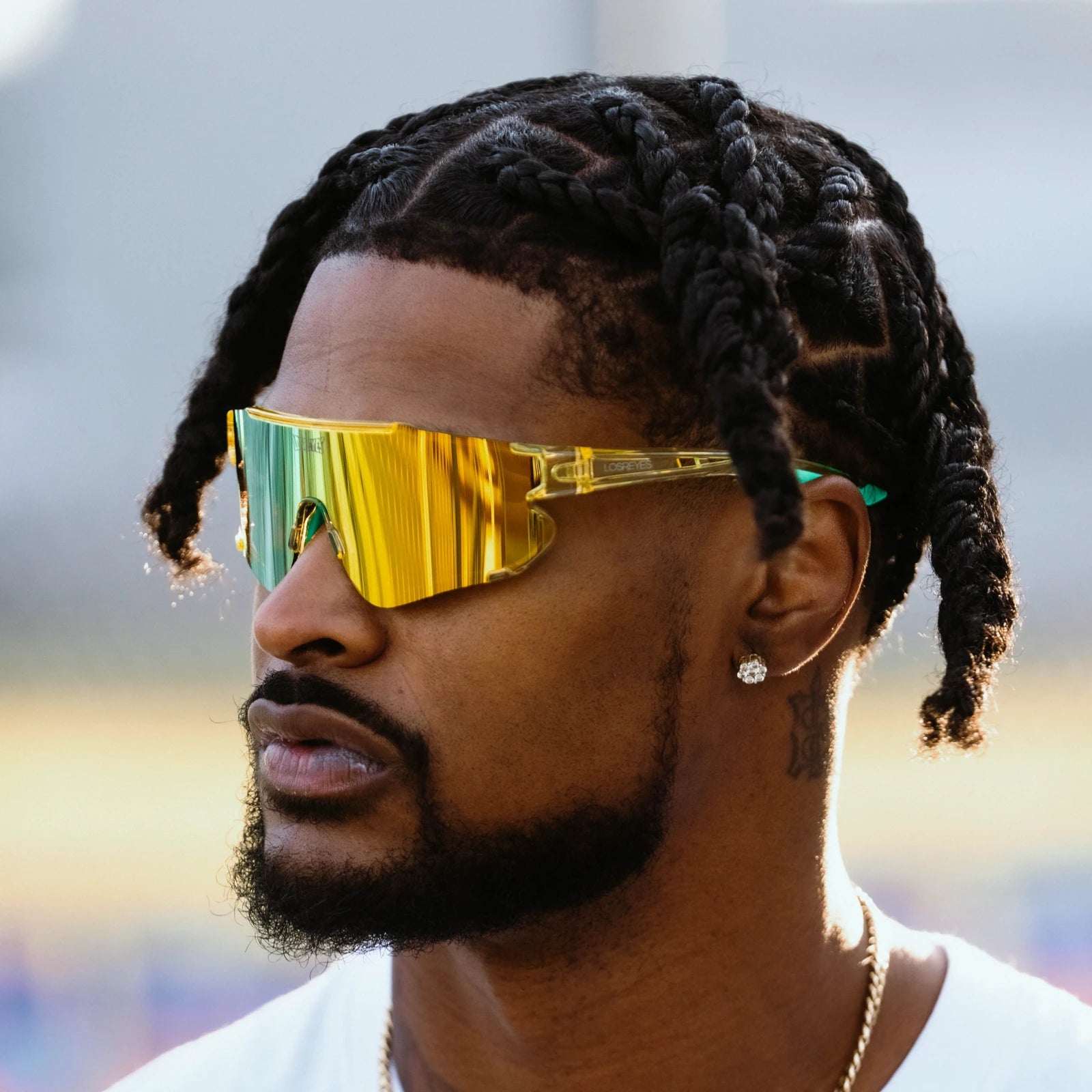 Former football athlete Ross500 wearing Elevate Lime LosReyes running sunglasses engineered with polarized UV400 lenses and flexible TR90 for endurance and performance.