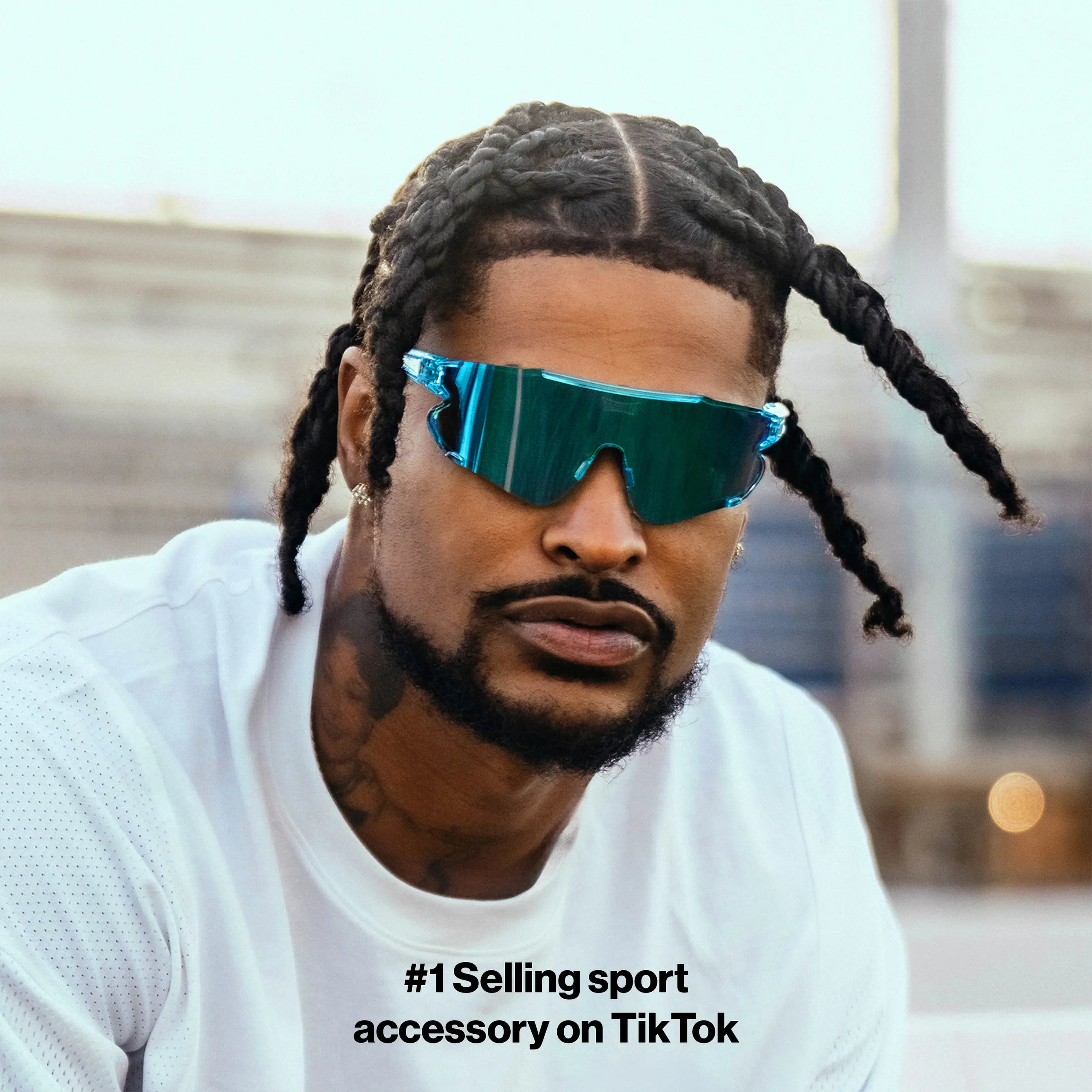 Athlete Ross500 sporting Elevate blue raz LosReyes track sunglasses designed for runners and sprinters, featuring polarized UV400 lenses and aerodynamic TR90 build.