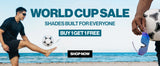 World Cup Sale desktop banner featuring a man kicking a soccer ball on the beach next to blue mirrored sport sunglasses, with Buy 1 Get 1 Free offer